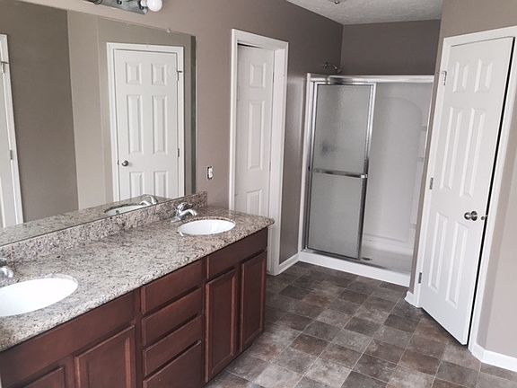 Double sinks, granite countertops, full bath