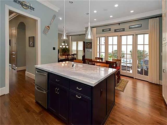The kitchen overlooks the breakfast room and French Doors that lead to the courtyard!