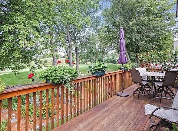 Large deck with wonderful landscaped views - and the Brackett's Crossing 15th green in the backgroun