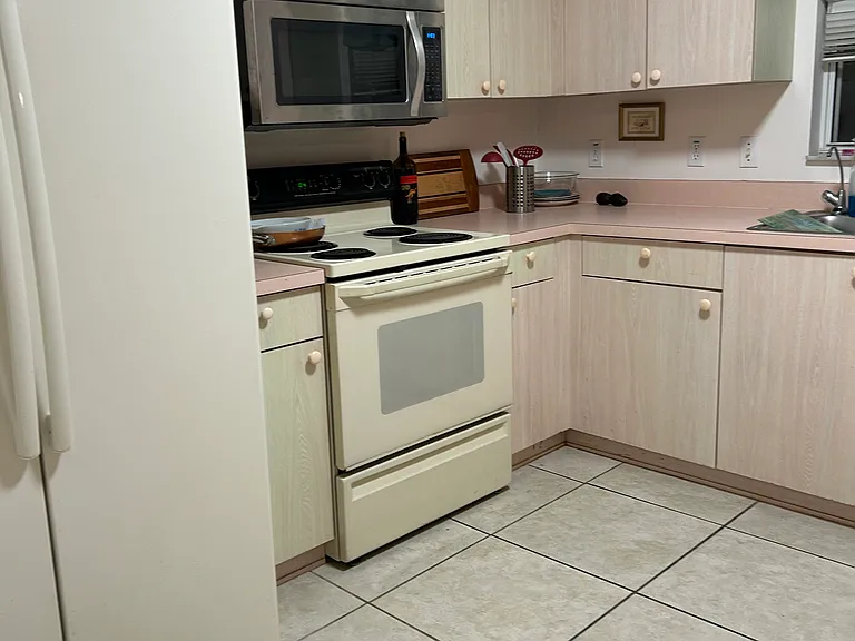 Kitchen has a long shelf (not in picture) for food prep.