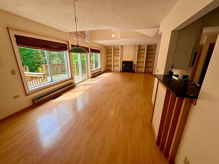 Dining area with cutout to the newly remodeled kitchen