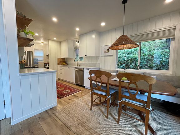 kitchen flows into living room and out slider to the partly covered deck