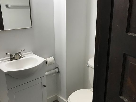 newer toilet and vanity