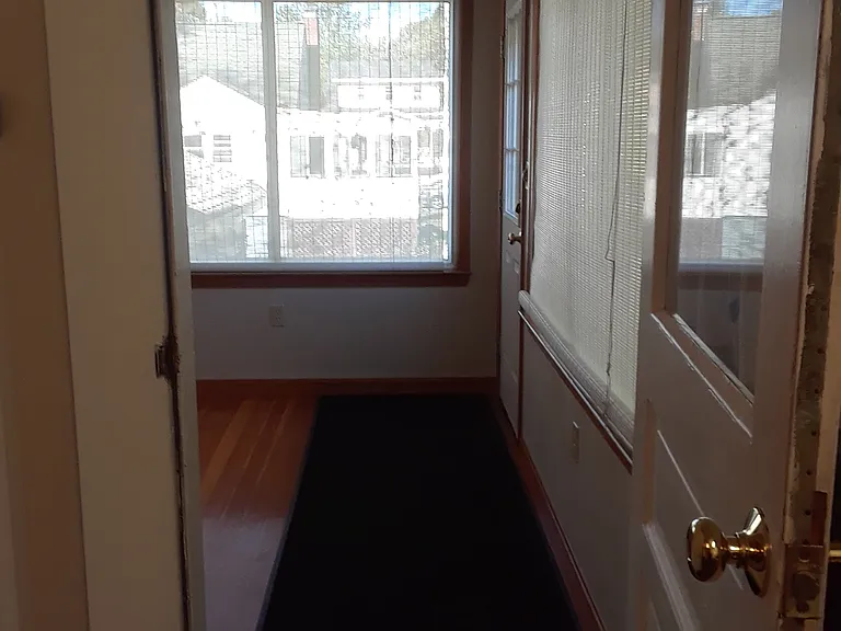 Kitchen into Sunroom / Back Entrance