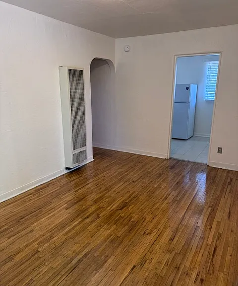 Living room facing kitchen entrance