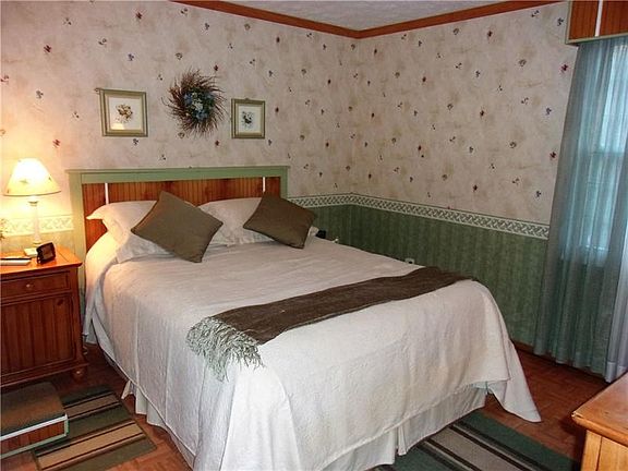 Master bedroom in rear of house measures 11x10 and features a large closet.