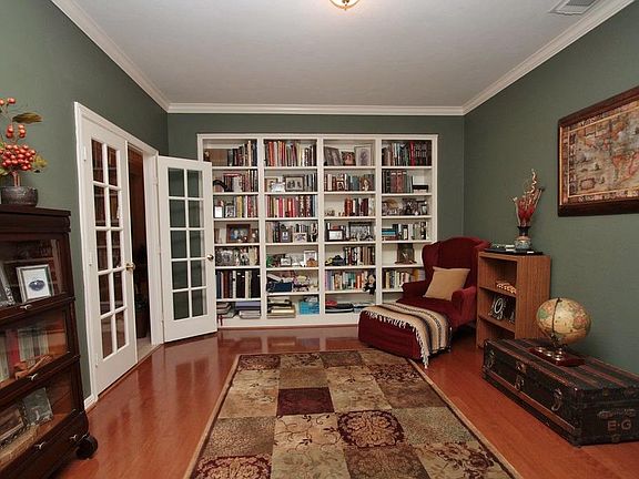Here's a direct view of the custom bookcase and French doors.