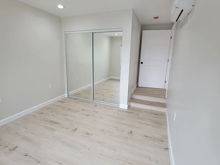 Large bedroom with mirrored closet!