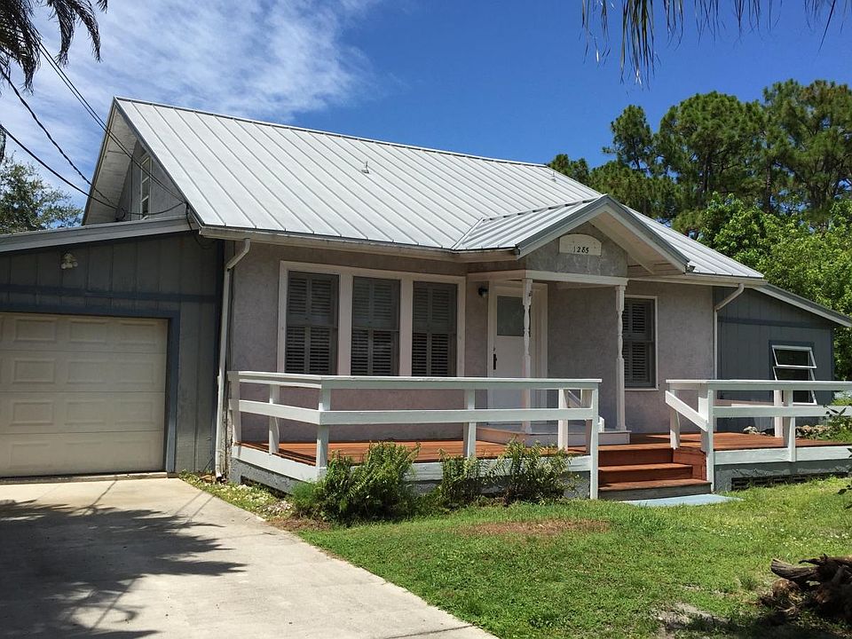 Front of house, faces South.