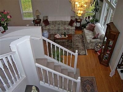 Looking down at stair case and living room