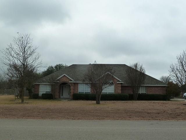 FRONT. NEW PICTURE COM,ING WITH BEAUTIFUL TREES AND PLENTY OF SPACE, RV PARKING, GATE TO BACK YARD AND CARPORT.