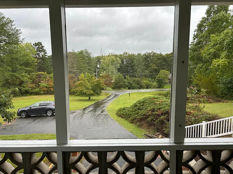 View of front & driveway+ 2 additional parking spaces from sunroom