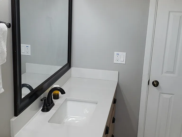 New Remodeled Bathroom Shower, New Vanity and New Quartz Countertop and Faucets Looking Out.
