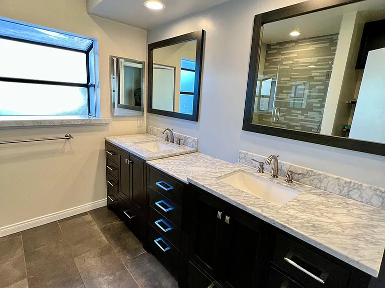 Bay window, dual marble vanities /cabinets