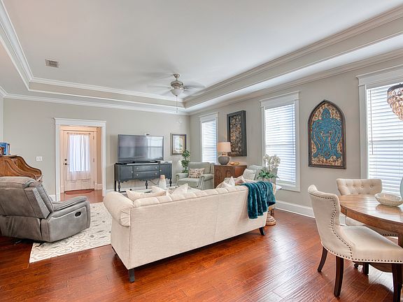 Spacious living room with crown molding