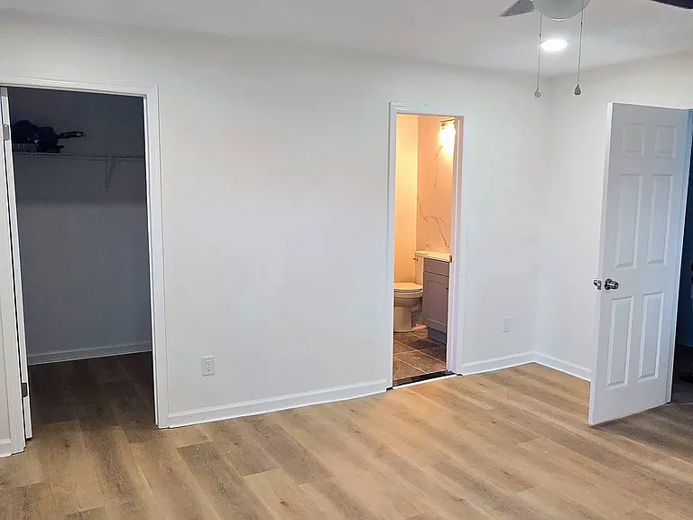 Large Master Bedroom with Recessed Lights, Ceiling Fan, Walk In Closet and Master Bathroom.