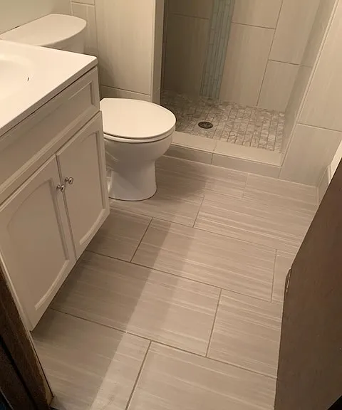 Fully remodeled, tiled, lower bath with walk-in shower
