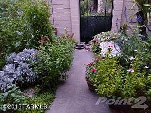 Front patio w/wrought iron gate