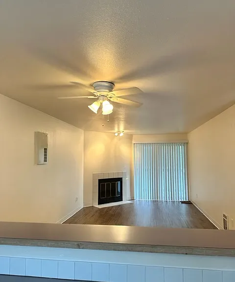Open concept kitchen-to-dining-to-living-room perspective