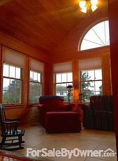 Sunroom
						:
						Beautiful sunroom finished in juniper and ceramic tile floor. River view
