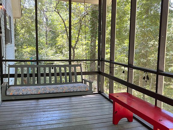 Screen porch at the front entrance of home.