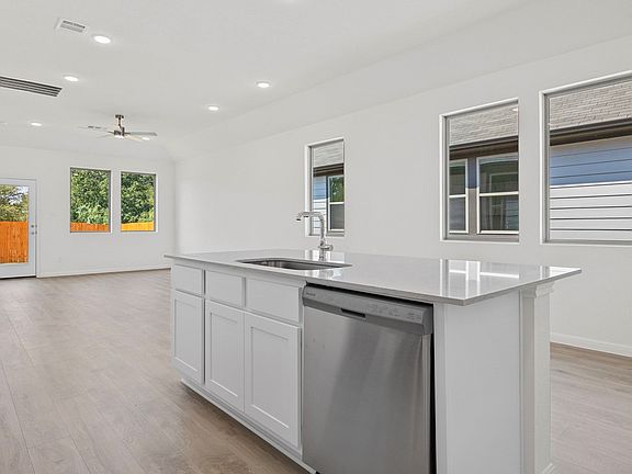 Kitchen in the Elm home plan by Trophy Signature Homes - REPRESENTATIVE PHOTO
