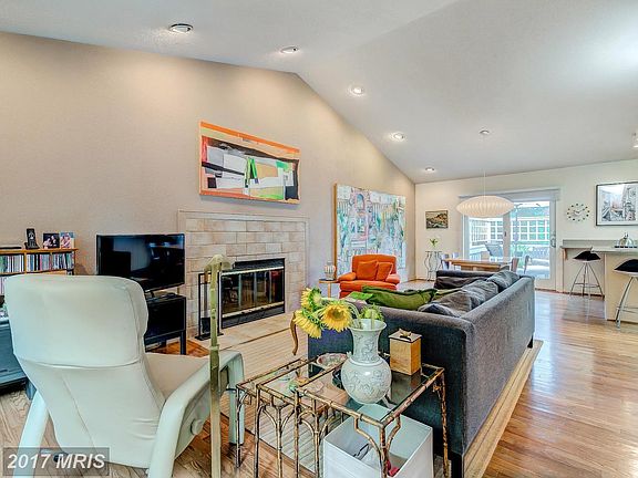 opens to kitchen and deck