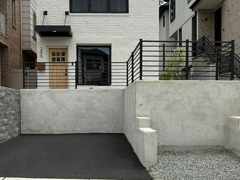 The Front View (with private parking pad)