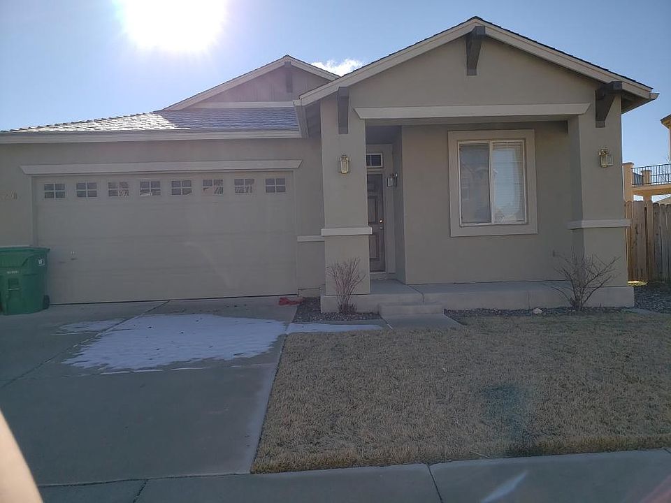 Front of the house looks compact, but it is long into the huge backyard. I like the humble exterior front elevation. It is also very pretty at night with the exterior lights on. The sun sets to the right as you are facing the house, so the front porch is