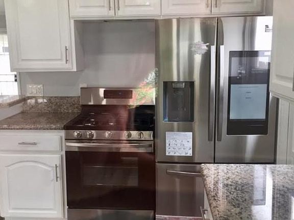 Upgraded gas range and 28 cu ft smart refrigerator with water and ice making capability. New electric washer and dryer from Samsung is also included and is in the garage.