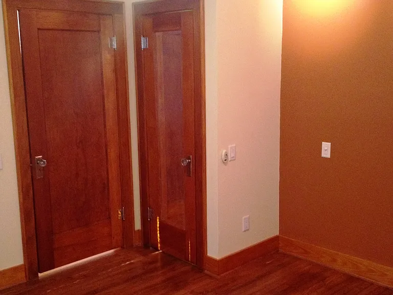 View toward front door and bedroom door.