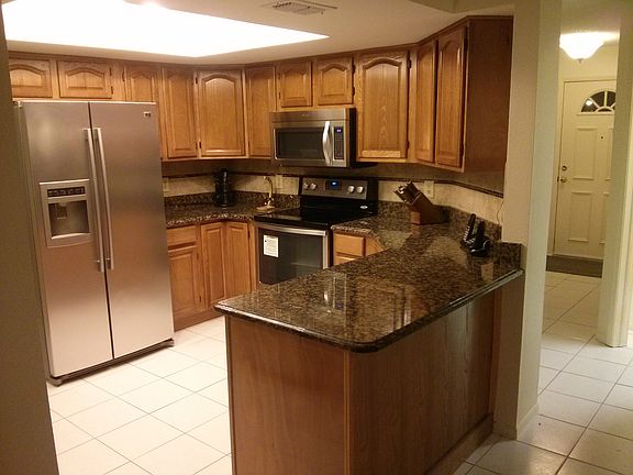Kitchen with new appliances, deep bowl sink, solid wood cabinets and granite 