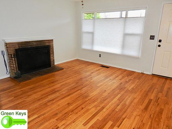 Large front window with blinds that open up or down