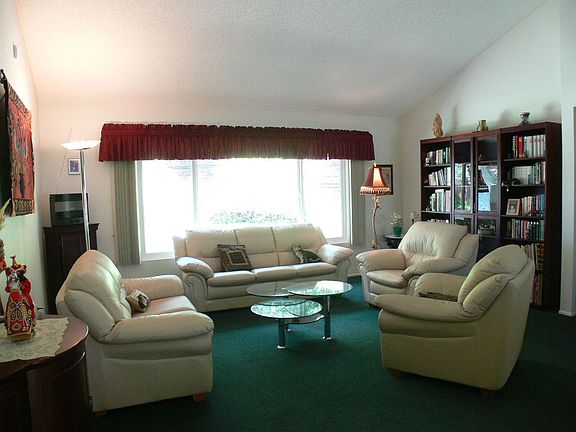 Lovely living room overlooking gorgeous backyard!