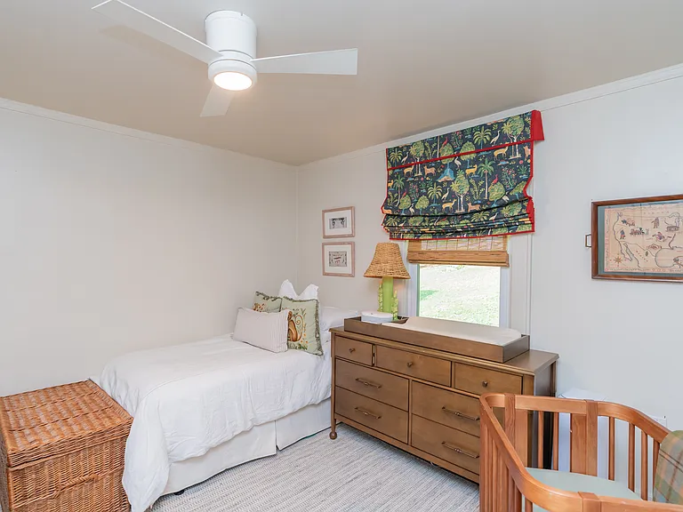 Bedroom 2, view of the backyard, full closet