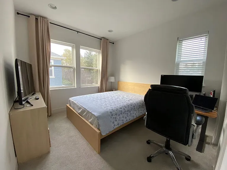 Guest bedroom 1 with 48x30 desk and queen size bed as comparison