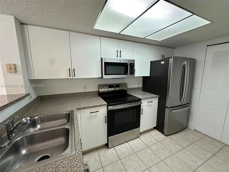 5011 Wiles Rd #203 — Photo 20