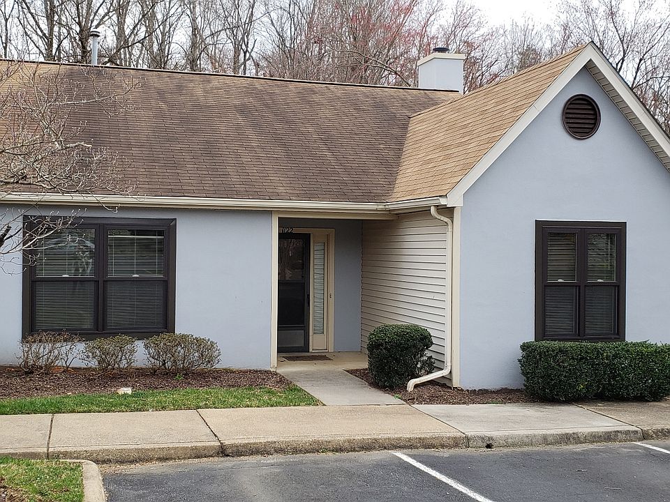 This home is an end unit on a short row of attached homes.
