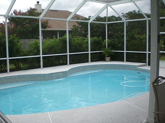 Screened in Pool w/waterfall