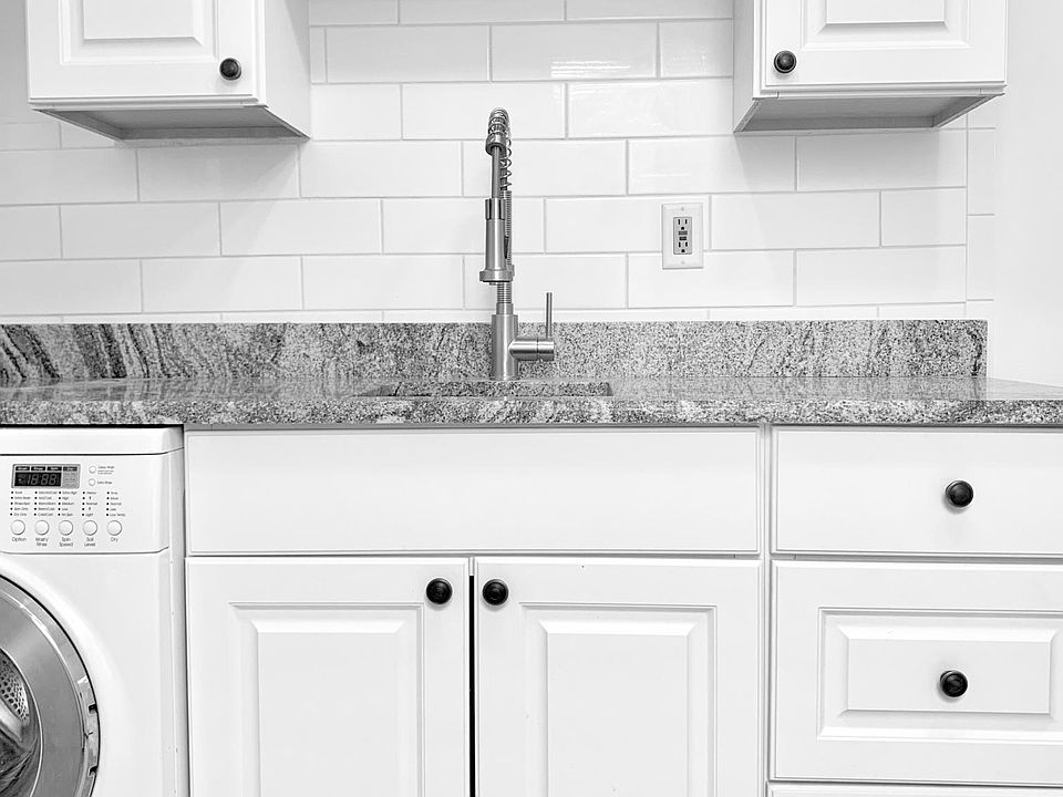 Kitchen cabinets and counter with washer-dryer