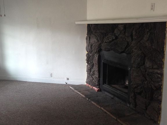 Fireplace in living room decorative only.