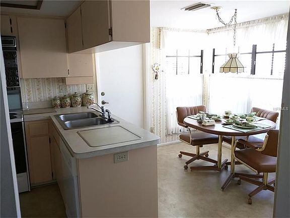 Viewed from the Dining area is the  Kitchen Breakfast nook; Garage access door.