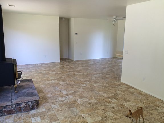 Open living and hallway to master bedroom.