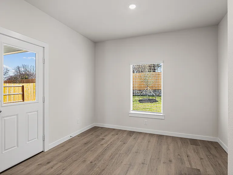 The dining room has large windows that let in great, natural light.
