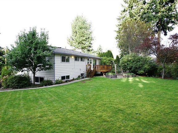 Huge lot with lovely grounds, mature landscaping.
