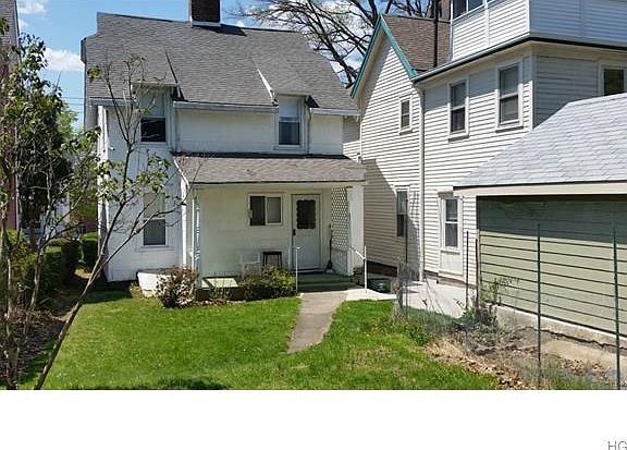 Rear of house showing back porch and garage.