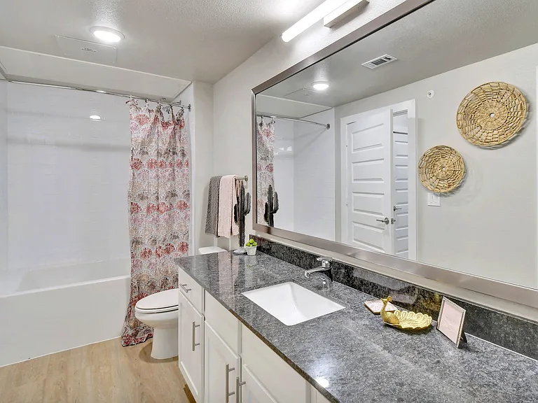 Soaking tubs with custom tile surrounds.