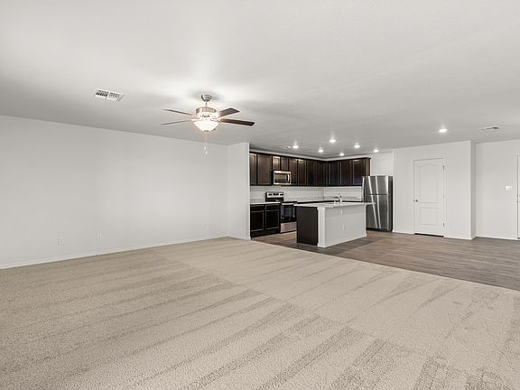 Spacious layout with a large living room connected to the dining area and kitchen.