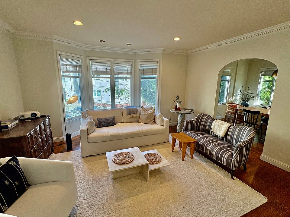 Sunny living room flowing into a separate dining room