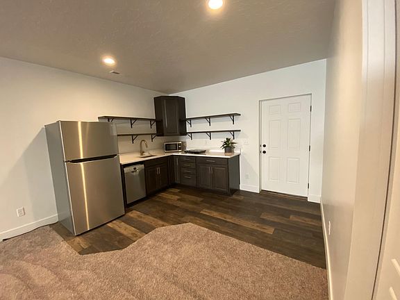 Front door and kitchen area